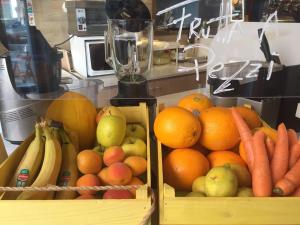 two boxes of fruit and vegetables in a kitchen at GUENDALINA SWEET HOME - LA CASETTA Di GUENDALINA in Trani