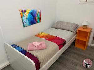 A bed or beds in a room at Casa Julka