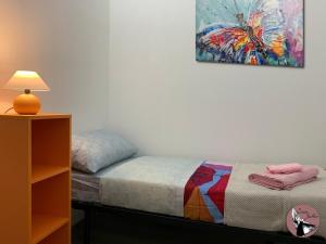 A bed or beds in a room at Casa Julka