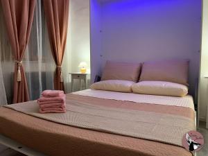 A bed or beds in a room at Casa Julka