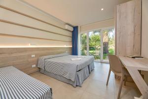 A bed or beds in a room at Hotel Villa Rodriguez