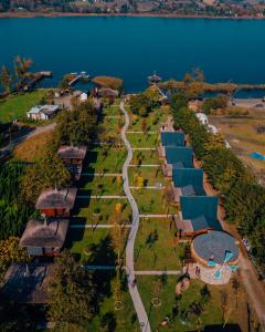 an aerial view of a park next to a lake at SAPANCA BAMBOOLOW RESORT in Sakarya