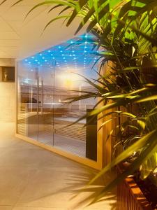 a large window with blue lights in a building at Hotel Schaepkens van St Fijt in Valkenburg