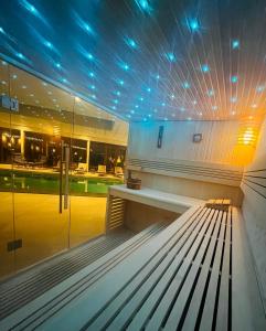 a bench in a building with lights on it at Hotel Schaepkens van St Fijt in Valkenburg