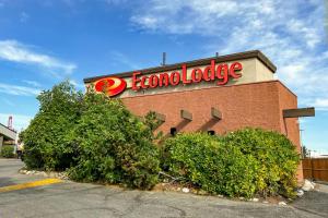 a store with a sign on the side of a building at Econo Lodge Motel Village in Calgary