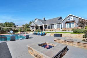 a backyard with a pool and a house at Tres A Lake Retreat in Canyon Lake