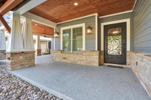 a front door of a home with a wooden ceiling at Tres A Lake Retreat in Canyon Lake