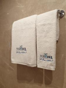 two towels on a towel rack in a bathroom at Terminal Inn Fully Furnished Hotel & Apartment- Al Mansoura in Doha
