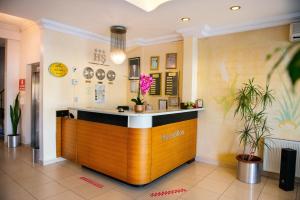 a restaurant with a counter in a lobby at Hotel Simsek in Edirne