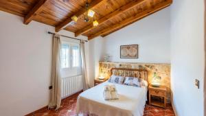 A bed or beds in a room at Cortijo Rural Claudia Taberno by Ruralidays