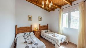 A bed or beds in a room at Cortijo Rural Claudia Taberno by Ruralidays