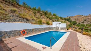 The swimming pool at or close to Cortijo Rural Claudia Taberno by Ruralidays