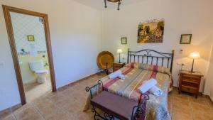Postel nebo postele na pokoji v ubytování El Romo Colmenar by Ruralidays + 11 fotografií
