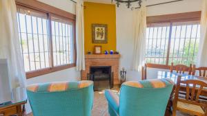 A seating area at El Romo Colmenar by Ruralidays