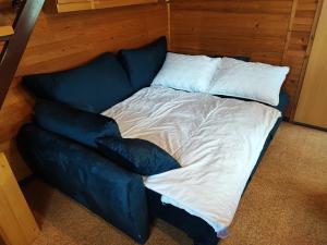 Кровать или кровати в номере Hišica 70