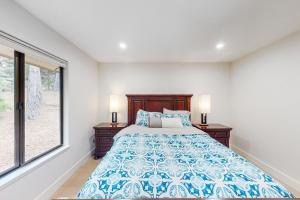 a bedroom with a bed and a large window at Pebble Beach Abundant Oasis in Pebble Beach
