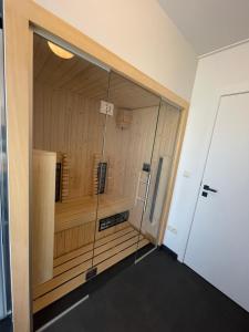 a room with a sauna in a building at Vakantieappartement Logies Terhagen in Zoutleeuw