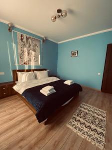 Rúm í herbergi á Guesthouse Relax in Kazbegi