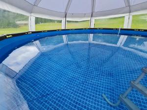 an overhead view of an empty swimming pool at Chalet L'Ange Des Neiges - Relax & SPA in Valtournenche