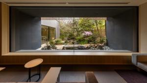 a room with a large window with a garden outside at Fufu Kyoto in Kyoto