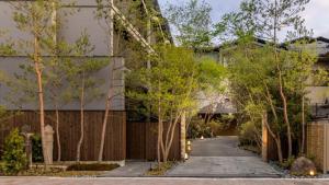 a walkway in front of a building with trees at Fufu Kyoto in Kyoto +39 photos