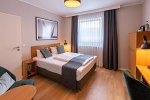 Postel nebo postele na pokoji v ubytování Comfort Hotel tom Kyle