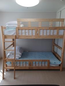 a bunk bed room with two bunk beds in a room at GOOD VIEW Guest House in Jeonju