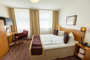 Postel nebo postele na pokoji v ubytování Comfort Hotel tom Kyle