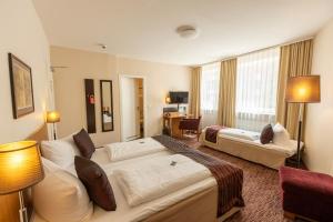 Postel nebo postele na pokoji v ubytování Comfort Hotel tom Kyle