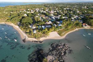 an aerial view of an island in the ocean at La grange de G. in Grand Gaube