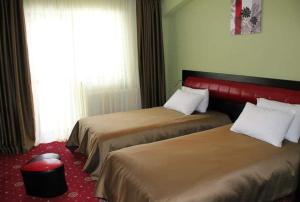 Łóżko lub łóżka w pokoju w obiekcie Hotel Villa Palace