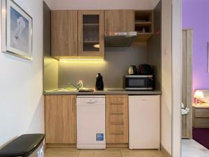 A kitchen or kitchenette at ABT Apartments Karoly