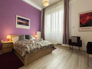 A bed or beds in a room at ABT Apartments Karoly
