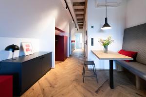 a living room with a table and a couch and a dining room at TORhaus Appartments Sendenhorst in Sendenhorst