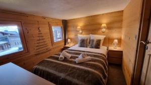 Postel nebo postele na pokoji v ubytování So cosy Val Thorens