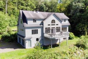 an aerial view of a house with a porch at Bovina Mountain High in Bovina Center