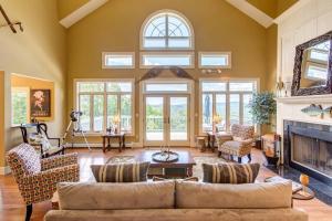 a living room with a couch and a fireplace at Bovina Mountain High in Bovina Center