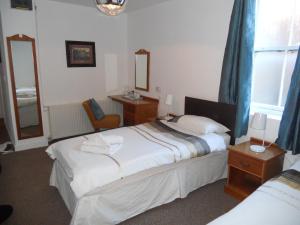 מיטה או מיטות בחדר ב-Yarm View Guest House and Cottages