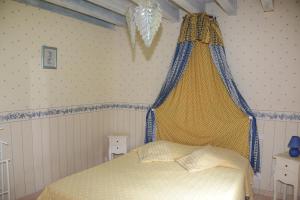 Llit o llits en una habitació de Le Clos du Rossignol