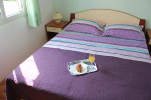 Posteľ alebo postele v izbe v ubytovaní Ruza Apartment