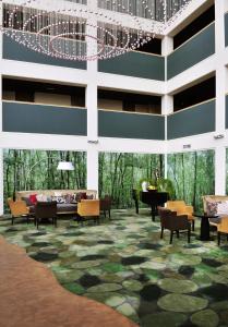 a rendering of a lobby with a grand piano at Fletcher Hotel-Restaurant Leidschendam – Den Haag in Leidschendam