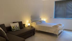 Posteľ alebo postele v izbe v ubytovaní Carolina Apartments - Monolocale