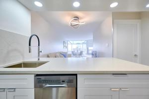 a kitchen with a sink and a counter top at Drake950 in Vancouver