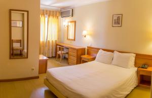 Cama ou camas em um quarto em Hotel Belsol