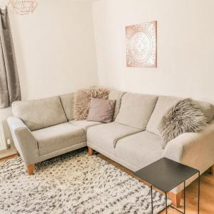 a living room with a couch and a table at Welcome Home in Royston