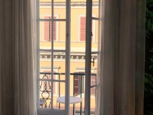 an open window with a view of a building at AmoRoma Vatican in Rome