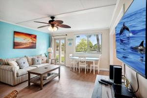 a living room with a couch and a table at Friendly Native 507 in St Pete Beach