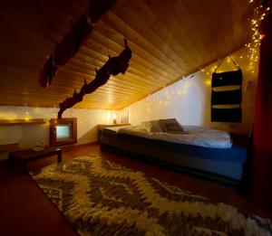 a bedroom with a bed in a room with lights at Highest terrace Verbier center. Top comfort & view in Verbier