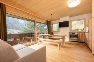 a living room with a couch and a table in a room at Ferienhaus Pension Gulla in Neustift im Stubaital