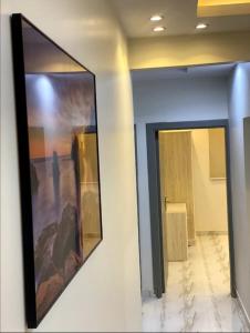 two mirrors on a wall in a room at المغتره للشقق الفندقيه in Ad Dawādimī